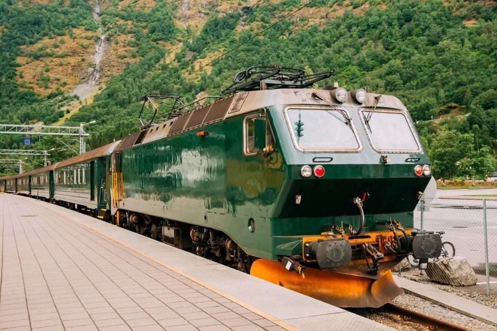 Flam, Norway. Famous Railroad Flamsbahn. Green Norwegian Train Near Railway Station. Electric train