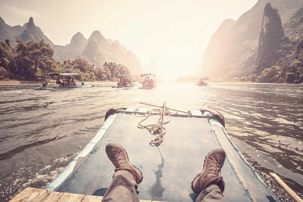 Li River bamboo raft from Guilin to Xingping with background in focus, color toning applied, China.
